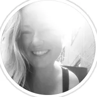 girl with blonde hair in front of a bright light